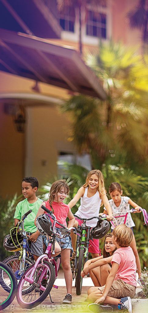 photo of kids playing and riding bikes