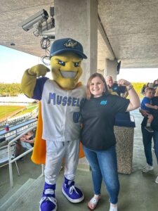 Erica Fish with Mighty Mussels mascot