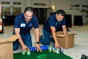 Employees build a golf hole.